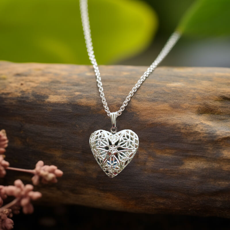 Silver heart filigree locket with a picture inside